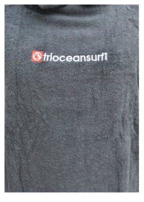 Triocean Surf Towel Changing Robe close up of logo
