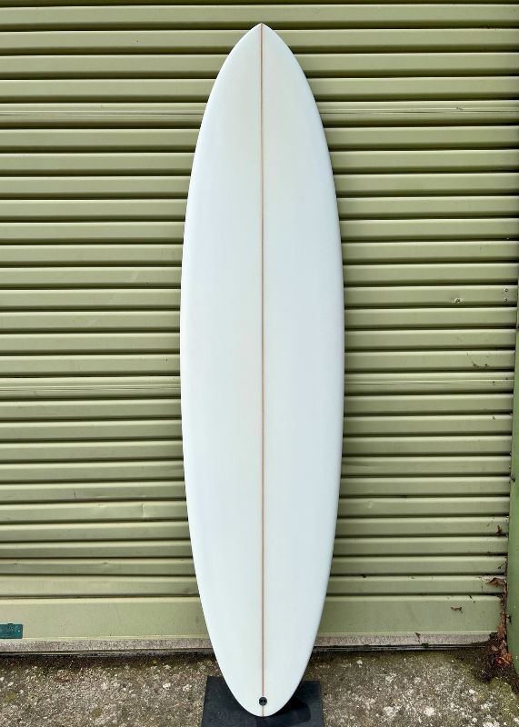 ocean magic midlength surfboard with custom art deck