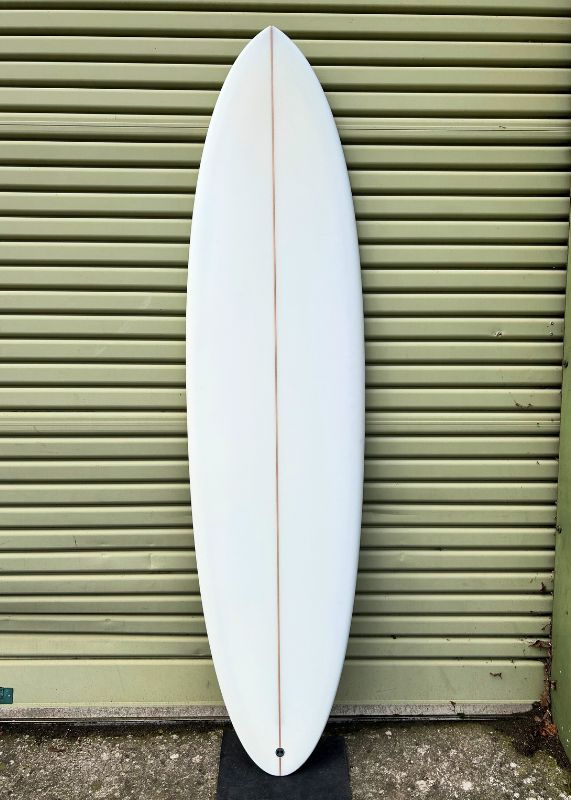 ocean magic midlength surfboard with custom mermaid art by Marina Beling deck